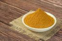 Fine orangish-brown turmeric powder